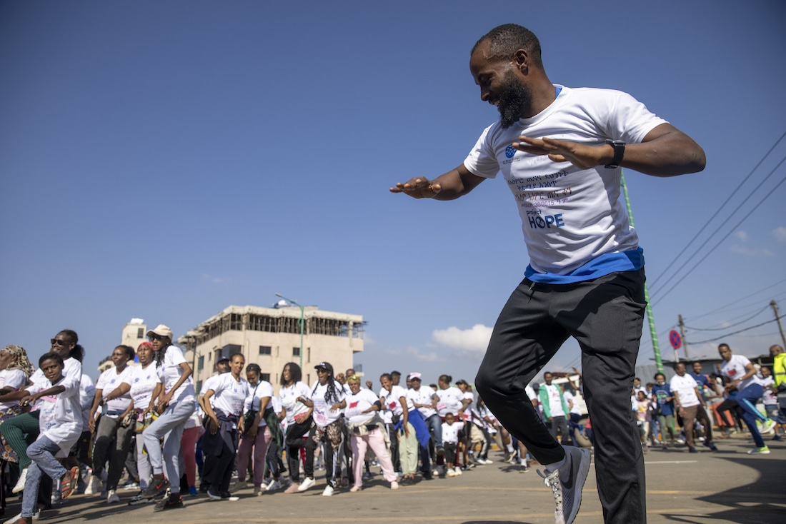man leads dance line in Ethiopia
