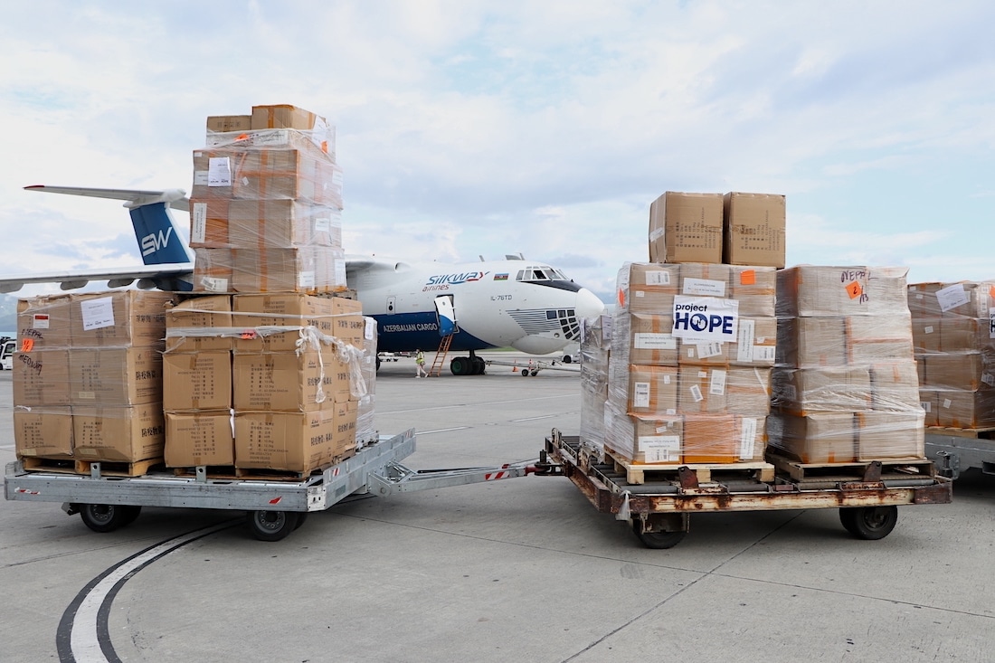 airplane at the tarmac awaiting medical supplies to be loaded in