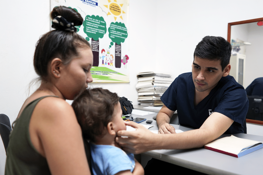 Dr. Jose examines a young patient