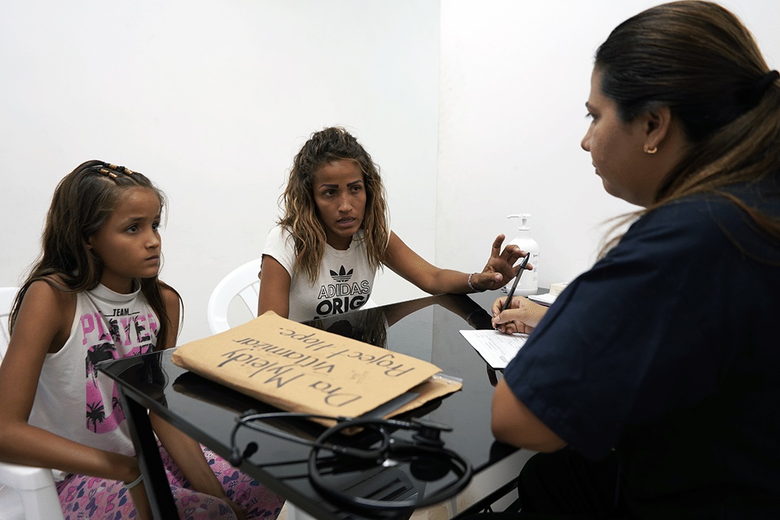 Patients talking to a doctor.