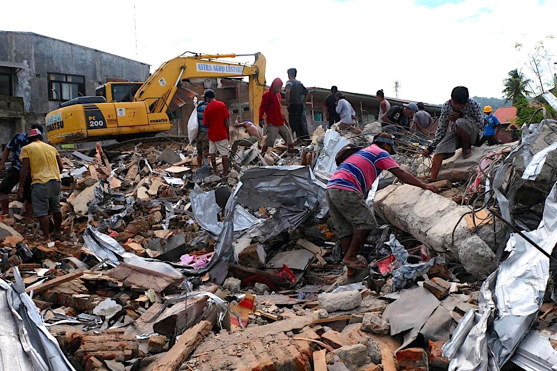 people going through rubble