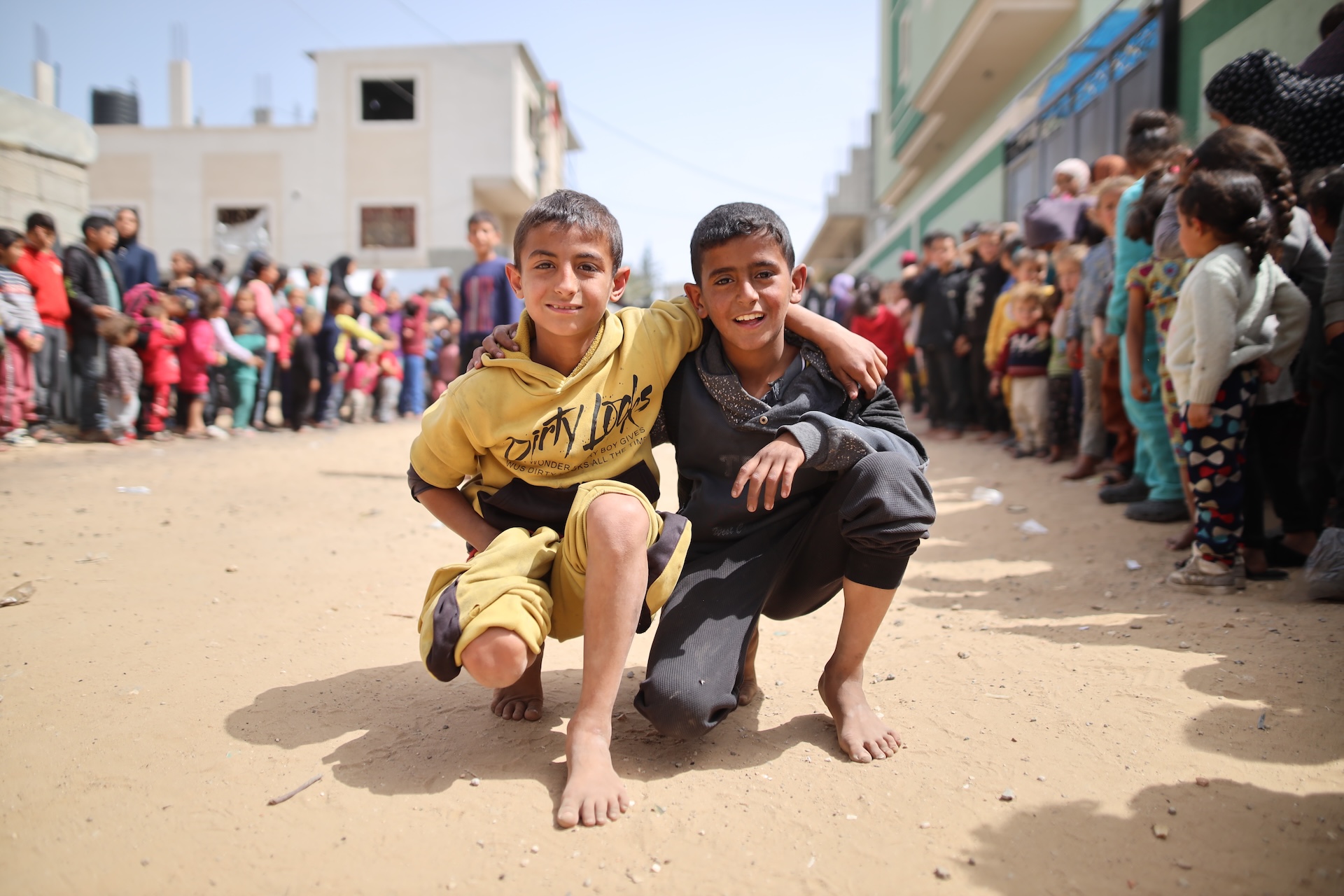 Two young boys posing together in Gaza