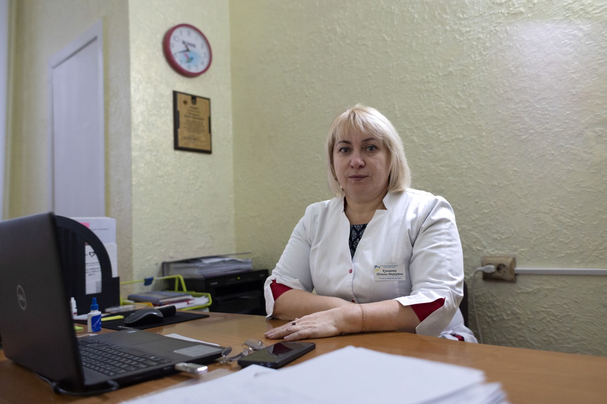 woman sits behind desk in Ukraine